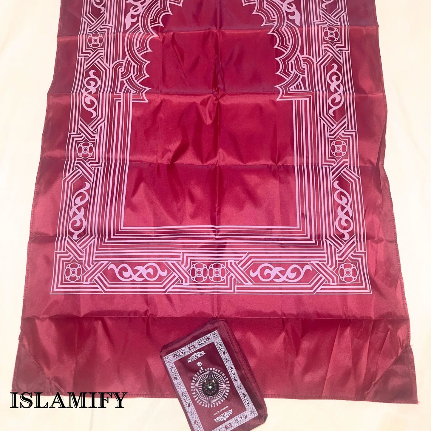 Red PocketPray portable prayer mat with matching pouch by Islamify – foldable, waterproof, and ideal for travel or outdoor prayers