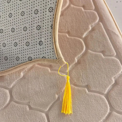 Close-up of Islamify foam padded prayer mat showing non-slip base, soft velvet texture, and yellow tassel