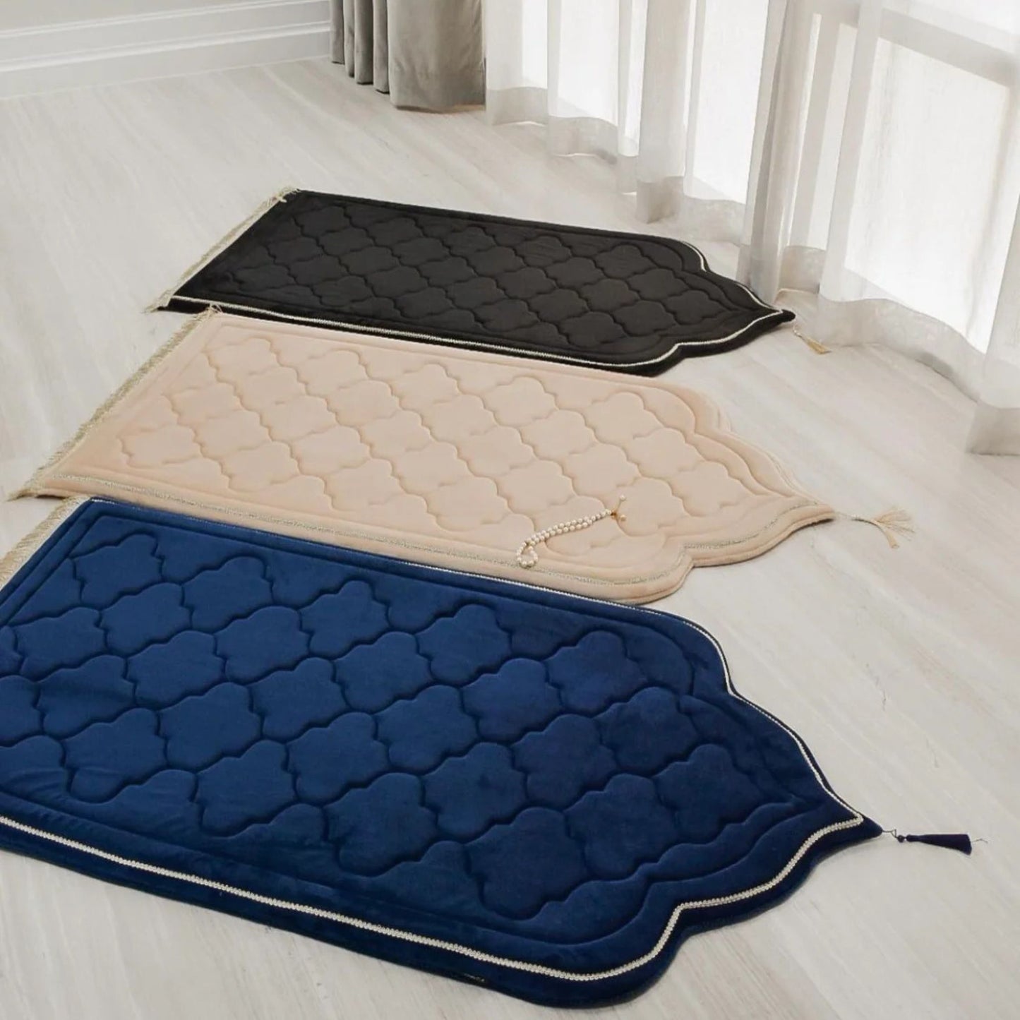 Luxury foam padded prayer mats in black, beige, and navy blue by Islamify