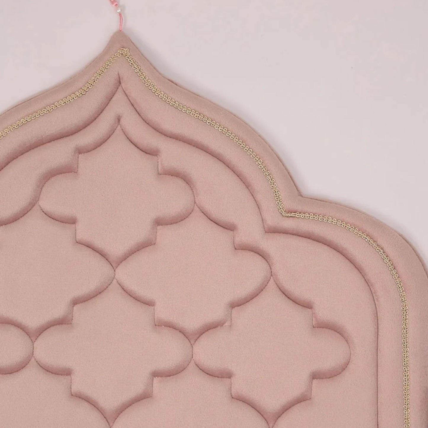 Close-up of soft pink foam padded Islamic prayer mat with elegant stitching by Islamify