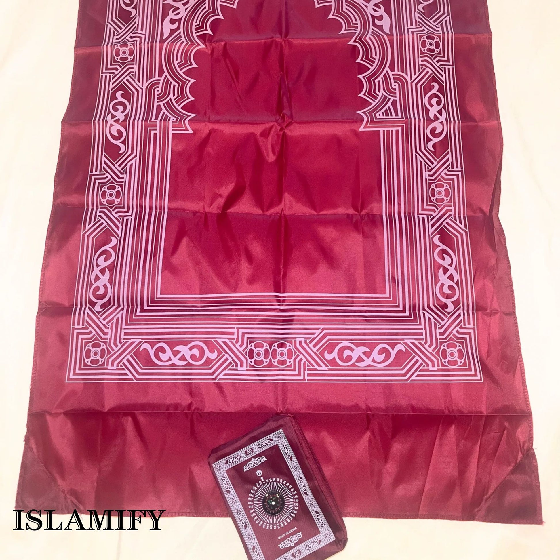 Red PocketPray portable prayer mat with matching pouch by Islamify – foldable, waterproof, and ideal for travel or outdoor prayers